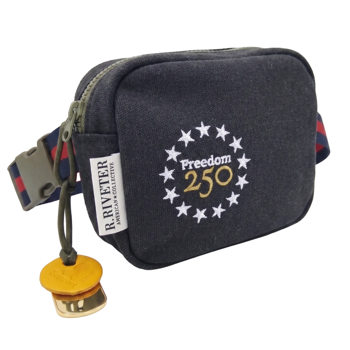 Black waist bag with 'Freedom 250' design and Riveter label on a white background