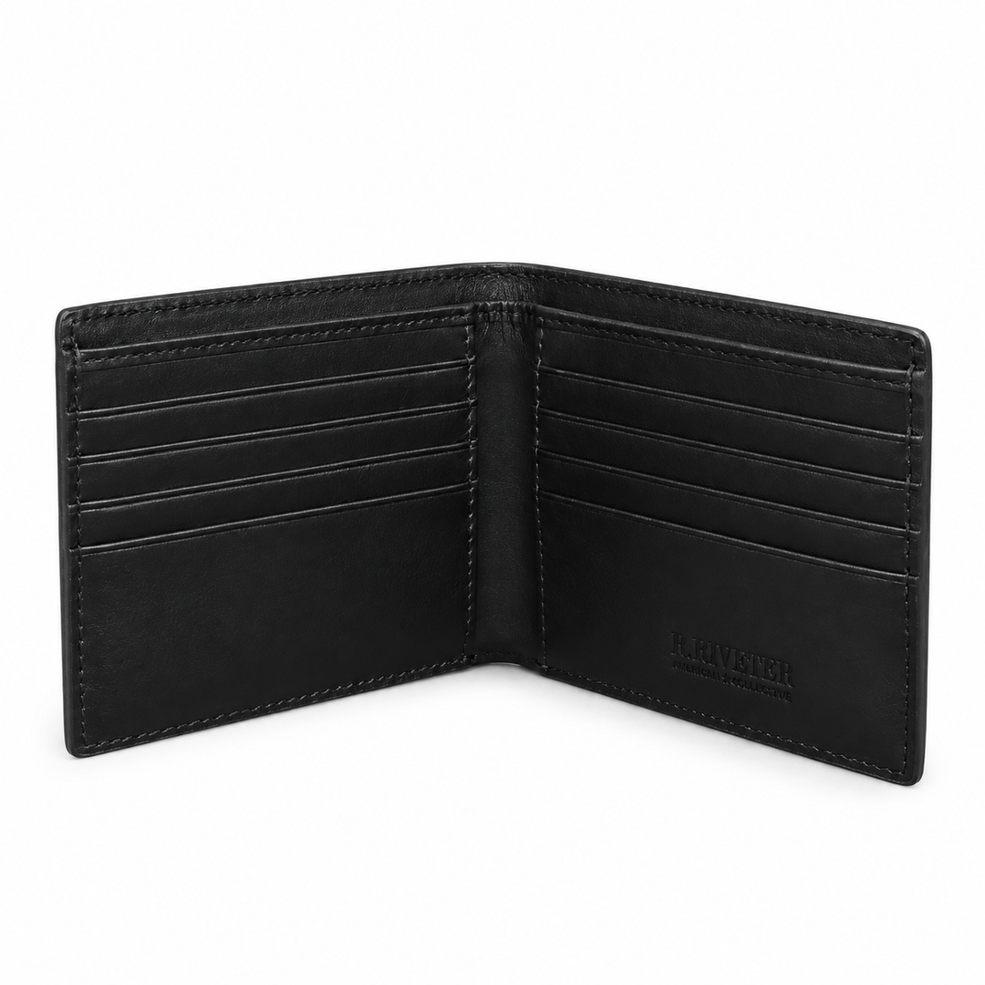An open black leather bifold wallet with multiple card slots and visible stitching, photographed on a clean white background. The brand name 'J.