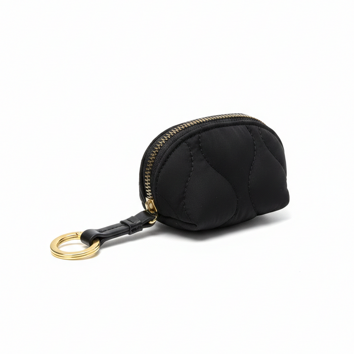 Black keychain pouch with gold zipper and ring on a white background