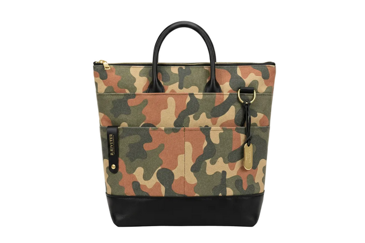 Camouflage-patterned handbag with black accents on a white background