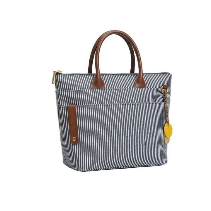 Blue striped handbag with brown handles and accents on a white background