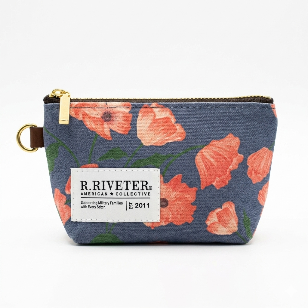 Floral patterned pouch with 'R. Riveter' label on a white background