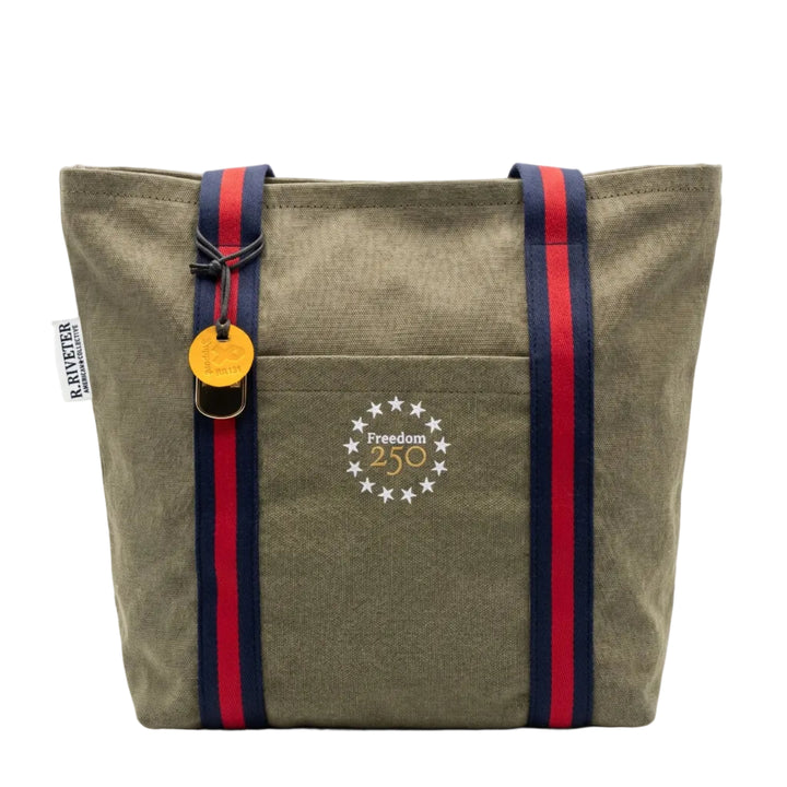 Green tote bag with red and blue straps on a white background