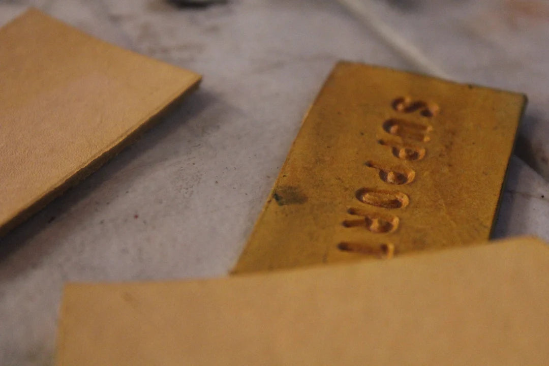 Close-up of the original yellow Support tag