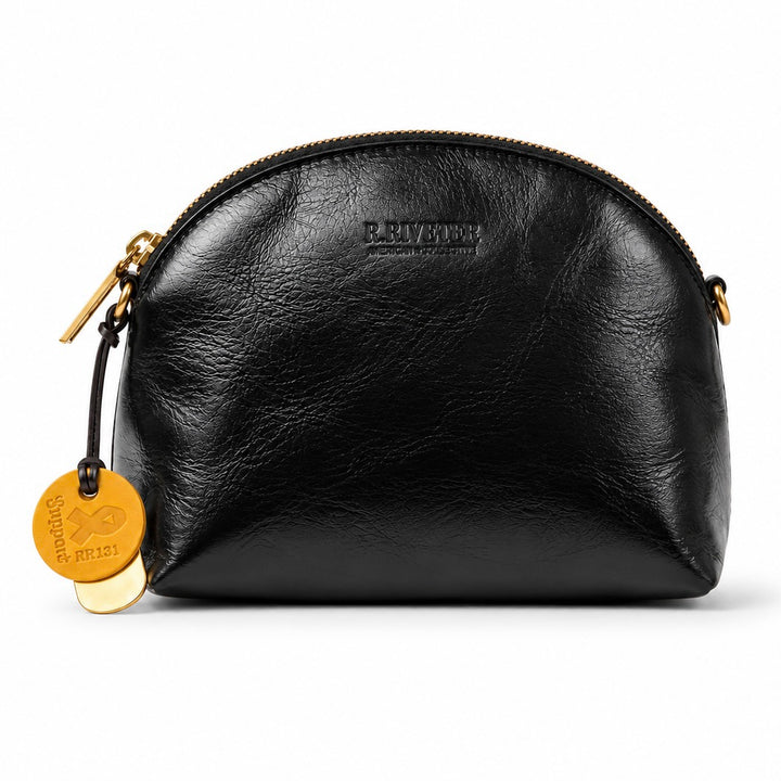 A black textured leather pouch bag with gold-tone hardware, featuring a debossed 'R.IVERING' logo on the front and a hanging round gold tag, shown against a plain white background.