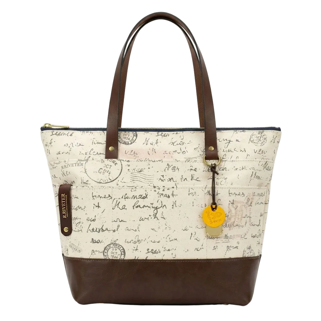 Tote bag with script pattern and brown accents on a white background