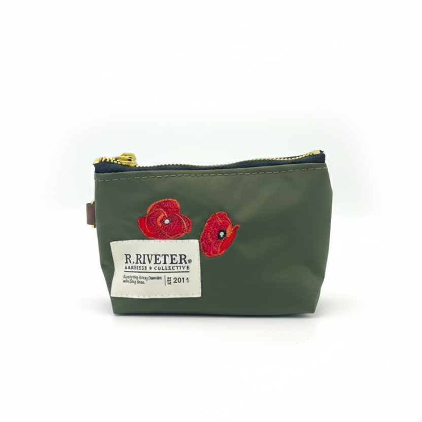 Green pouch with poppy designs and Riveter branding on a white background