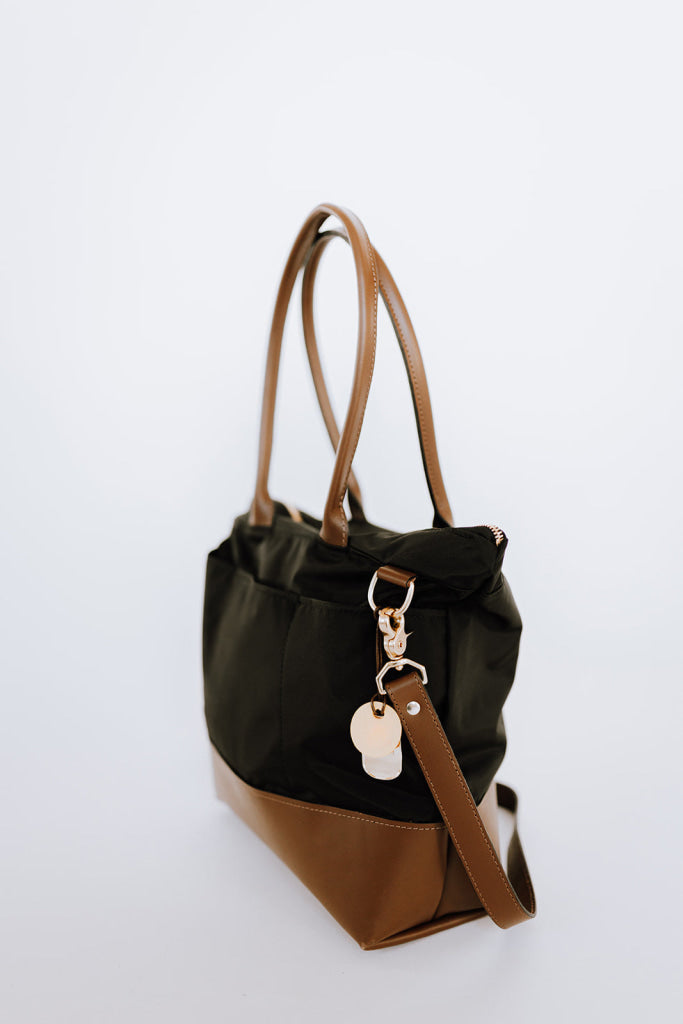 Black nylon bag with brown leather straps outlet