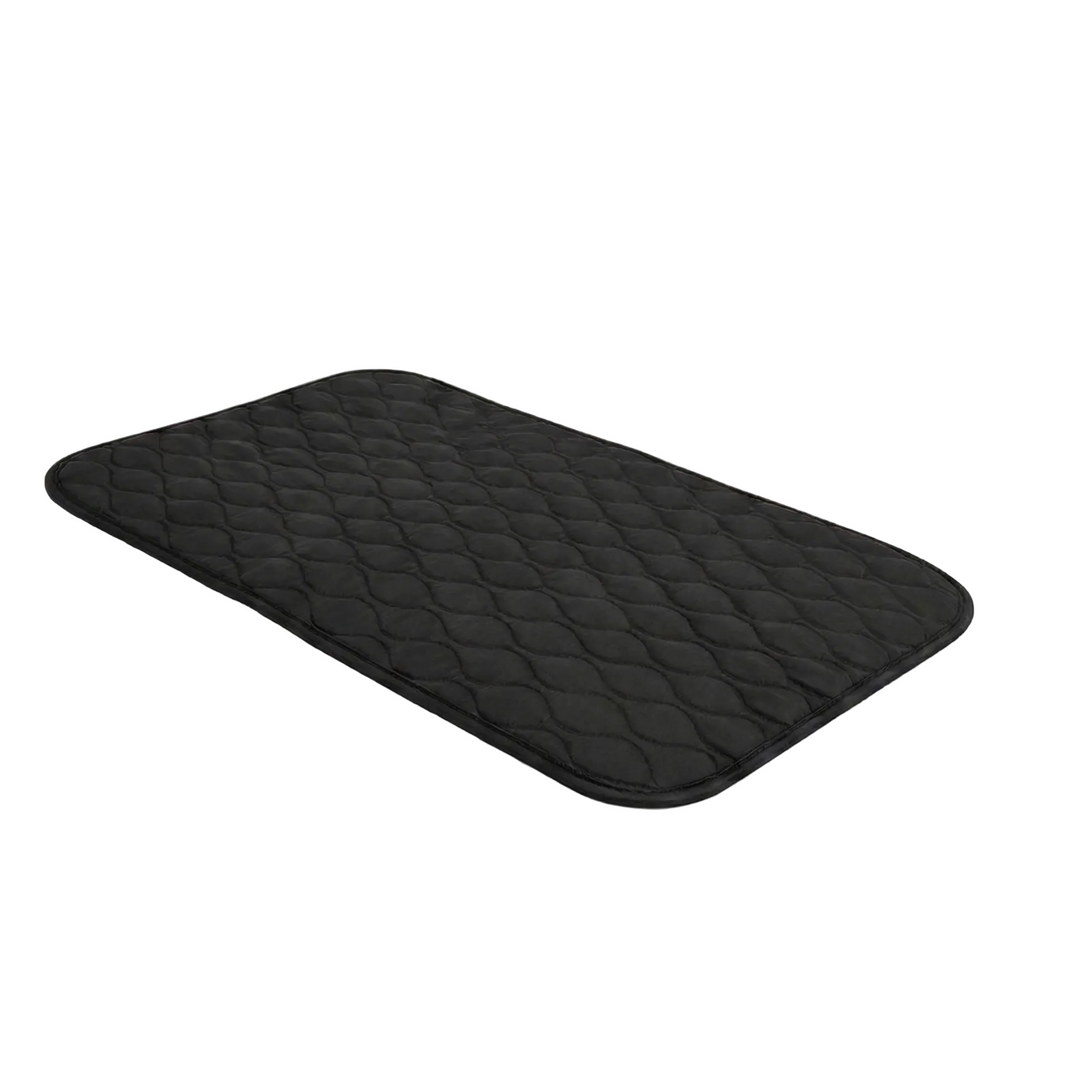 Black quilted car mat on a white background