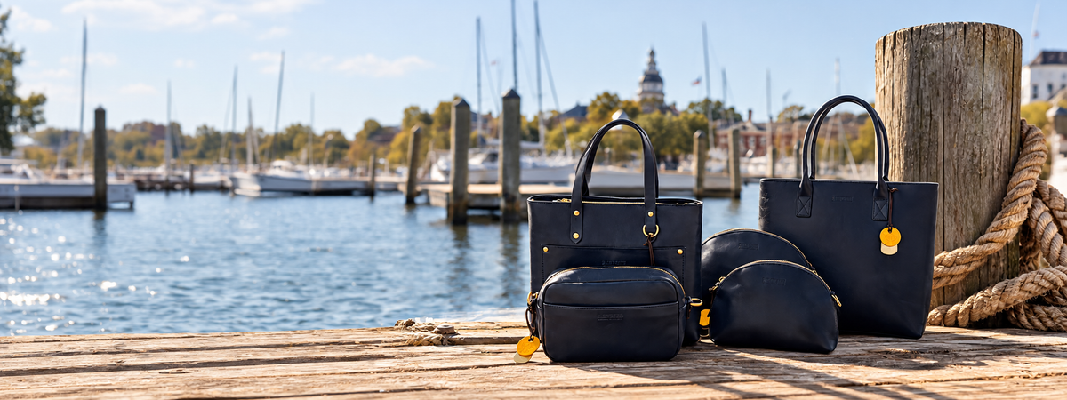 Inkwell Blue leather crossbody bag beside the waterfront
