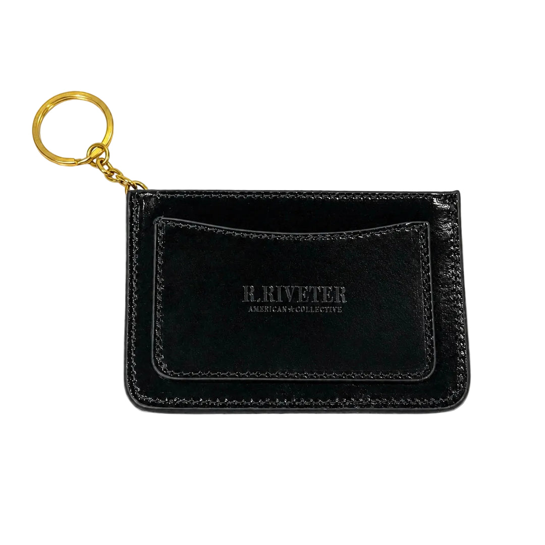 A black leather card holder keychain with a gold split ring and chain, featuring the debossed brand name 'H. KIVETER AMERICAS & COLLECTIVE' on the front pocket, set against a plain white background.