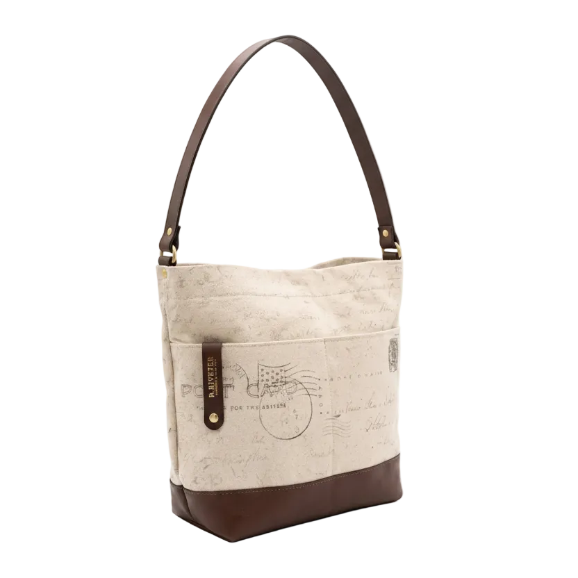 Beige handbag with brown leather accents on a white background